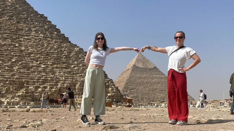 Students with pyramids in Cairo, Egypt